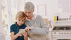 Smartphone, kitchen and grandma with child for cooking website, social media post and blog tips for home development. Family kid and grandmother help, support and using phone to search video online