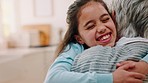 Girl running to hug grandmother for love, affection and bonding on weekend together in family home. Relax, childhood and grandma hugging child in kitchen excited, happy and overjoyed for quality time