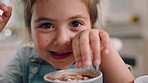 Face, hot chocolate and girl in home kitchen ready to drink and have delicious treats. Portrait, morning smile and happy child nodding and preparing for sweet breakfast, cocoa or dessert beverage.