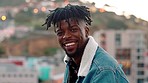 Travel, smile and face of black man in the city enjoying summer holiday, vacation and weekend in Barcelona. Freedom, city background and portrait of male on adventure, journey and traveling lifestyle