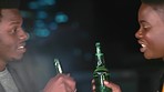 Couple, beer toast or city night date, New Year celebration or birthday event on house, home or evening building rooftop. Talking black woman, man or love and alcohol bottle in social gathering party