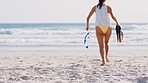 Running legs, beach and woman with snorkel by the sea and ocean ready for free diving. Morning, sports and run of a athlete on sand in summer on vacation for swimming and travel with water fitness 