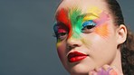 Beauty, face paint and aesthetic woman with color makeup and creative cosmetics with a perfect teeth smile for LGBTQ, pride and rainbow campaign. Portrait of England model zoom for art on skin