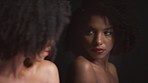 Black woman, beauty and sexy, face with mirror reflection and sensual with makeup, cosmetics and seductive. Dark, glow and skincare with black aesthetic. Afro, hair care and fashion model in art.