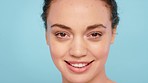 Face, skincare and woman in studio happy, smile and relax while grooming against blue background mockup. Portrait, model and girl in France for facial, skin and beauty cosmetics, treatment and pamper