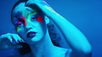 Beauty, neon lights or woman face with paint, art or creative for makeup, product or wellness. Portrait, girl or female with cosmetics, colorful or artistic for skincare, facial and studio background