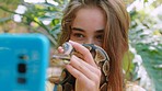 Selfie, snake and social media with a girl child taking a photograph with a reptile outdoor at the zoo. Nature, phone and children with a female kid posing for a picture with a python outside