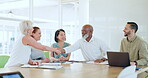 Handshake, meeting and partnership with a business team in an office boardroom for deal or agreement. Thank you, collaboration and diversity with a male and female employee shaking hands at work