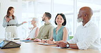 Portrait, meeting and training with a business asian woman sitting in the boardroom during a team seminar. Happy, smile and workshop with a female employee in an office with her colleague group