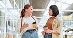 Creative business woman, friends and walking with coffee in funny discussion laughing together at the office. Happy employee women enjoying walk, social conversation and drink in startup at workplace
