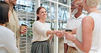 Teamwork, handshake and collaboration of business people in office for deal, agreement or partnership. Thank you, meeting and group, staff or coworkers shaking hands to welcome employee to company.
