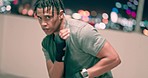 Boxing, city and fitness of black man in night bokeh for speed, power and challenge workout with focus, strategy and action. Dark rooftop, boxer energy and sports fist training for mma competition