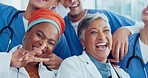 Doctor, team and face with smile for teamwork, collaboration or fun laughing in about us at hospital. Group of healthcare experts laugh and smiling in happiness for medical success or team building