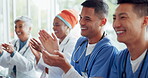 Healthcare, meeting and applause with a doctor man and woman team cheering in a hospital boardroom. Doctors, nurses and medical with a medicine group clapping during a seminar or training workshop