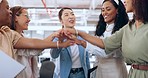 Business team, hands together and celebration of teamwork with women for collaboration, project management and team building in a office. Diversity female employees with motivation for success