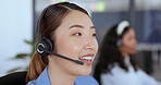 Face, call center and Asian woman consulting in office for customer service. Contact us, telemarketing and female consultant, sales agent or customer support worker talking on headset in workplace.