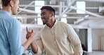 Handshake, greeting and business men at work with a welcome, thank you or communication. Happy, casual and corporate employees with hand gesture for a hello, agreement and coworking in an office