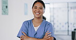 Nurse, face or arms crossed in hospital clinic with wellness motivation, medical research trust or surgery planning motivation. Portrait, smile or happy healthcare worker with confidence in Indonesia