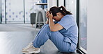 Nurse, depression and stress on hospital floor for patient loss, surgery fail or virus death rate in wellness, medical or community clinic. Mental health, sad and anxiety for healthcare worker woman