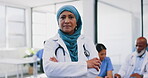 Woman, muslim and doctor with serious face at healthcare meeting in office with interracial coworkers and students. Professional hospital with senior worker with hijab and assertive portrait.