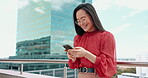 Asian woman, city business and phone on rooftop of office building for social networking, mobile app contact and reading digital news notification. Worker, balcony and typing on smartphone technology