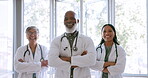 Healthcare, collaboration and insurance with a team of doctors standing arms crossed in a hospital together. Medical, teamwork and diversity with a medicine professional group working in a clinic