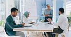 Presentation, senior woman and business people in a meeting planning, talking or speaking of sales growth or kpi targets. Leadership, team work or CEO in conversation about data analytics or strategy