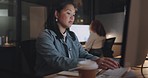 Business woman, focus and computer, typing and working overtime, journalist writing article for newspaper. Office, night and professional at desk, computer screen and technology with deadline.