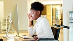 Stressed disabled bussineswoman having a mental breakdown and suffering from headache at her computer in an inclusive workplace. Depressed woman in wheelchair while struggling to cope with workload