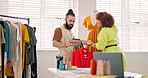 Fashion, ecommerce or tablet and a designer team working together with sample fabric on a mannequin. Startup, creative and teamwork with a man and woman at work on design in their studio workshop