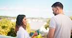 Couple, tea and coffee on vacation or holiday in the morning at hotel or on the balcony or terrace feeling happy. Lovers, man and woman bringing hot beverage in cup talking and enjoying quality time