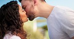 Couple, love and people kiss in the morning with coffee on vacation or holiday at a hotel or on the balcony. Lovers, man and woman holding hot beverage in a cup affectionate and quality time