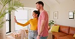 Video call, real estate and couple showing new house, happy and excited in their living room. Good news, property and homeowners sharing home online, smile and proud, moving and embrace in a lounge