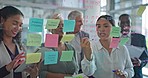 Teamwork, brainstorming and woman at presentation, ideas for team at startup and sticky note on glass wall. Strategy, planning and business coach in meeting at training workshop for agency employees.