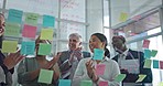 Coaching, brainstorming and applause for woman at presentation, celebration at startup and idea on sticky note. Strategy, planning and success at workshop meeting for agency employees at glass wall.