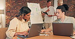 Laptop, teamwork and collaboration of business people in office work on project at night. Computer, cooperation and coworkers, man and woman typing, writing and working overtime in company.