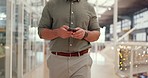 Business, man walking and texting on smartphone in office lobby reading email or time management schedule online. Technology, communication and checking social media on break with phone and internet 