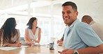 Business, office and man with smile at meeting or workshop for strategy, planning and performance report. Team leader, collaboration and diversity, happy businessman at table at advertising agency.