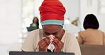 Black woman, sneeze and tissue blowing nose for sick, ill or flu by laptop at the office desk. African American woman employee with cold symptoms, virus or illness by computer at the workplace