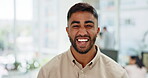 Face, fun and comic with a business man laughing or feeling carefree while working in his office. Portrait, smile and joke with a happy male employee looking positive or funny at work with humor