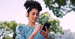 Black woman, smartphone and headphones, scroll through social media outdoor with music or podcast streaming, reading and smile. Phone, connect and communication with technology, hands and 5g network.