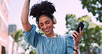 Music, phone and headphones, woman in park happy and excited while dancing in garden trees. Technology, smartphone and dance, happy woman enjoying streaming service or free internet radio station.