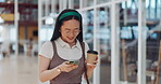 Phone, mall and Asian woman typing, social media or messaging. Technology, coffee and happy female with mobile smartphone for networking, internet browsing or web scrolling alone at shopping mall.