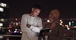 Communication, night balcony and business people working, talking or review online social media feedback. New York city rooftop, teamwork collaboration and black woman discussion on digital marketing