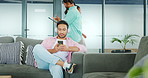 Startup, relax or Asian man with phone in office sofa for communication, networking or reading email. Worker, lunch break or employee with smartphone for social media, internet or blog content review