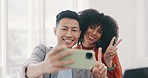 Phone, selfie and business people with peace in office for teamwork, collaboration and friendly workspace. Success, diversity and Asian man and black woman with smartphone, peace sign and smile