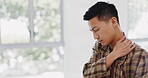 Asian businessman, touching hand or neck pain in modern office, marketing startup or advertising company with tired muscle tension. Stress, burnout or shoulder injury for worker stretching or rubbing