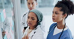 Meeting, healthcare and teamwork with a doctor black woman coaching her team on glass in a hospital. Planning, training or medical with a female medicine professional talking to a clinic group