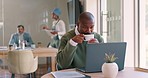 African businessman, coffee and laptop in office, reading and email for schedule, report or strategy. Corporate black man, computer and tea for energy, start morning and focus on marketing planning