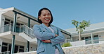 Face, vision and motivation with a business asian woman outdoor on a blue sky background standing arms crossed. Portrait, mission and mindset with a young female employee posing outside for growth